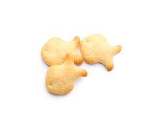 Delicious crispy goldfish crackers on white background, top view