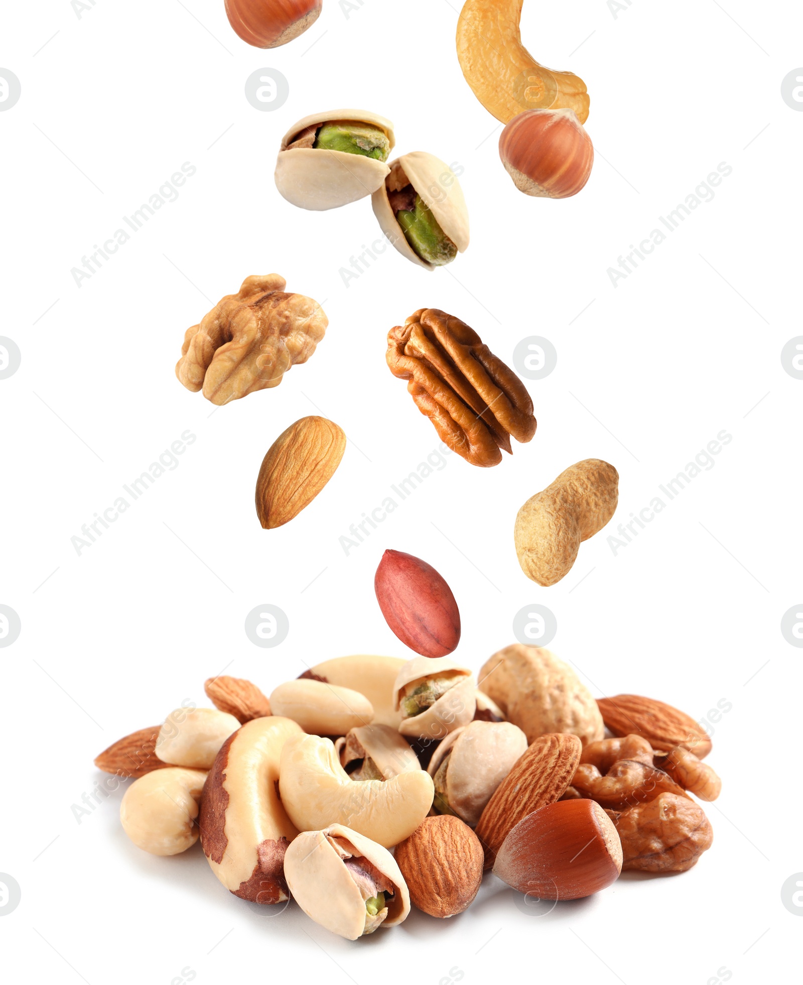 Image of Mix of different nuts falling on white background