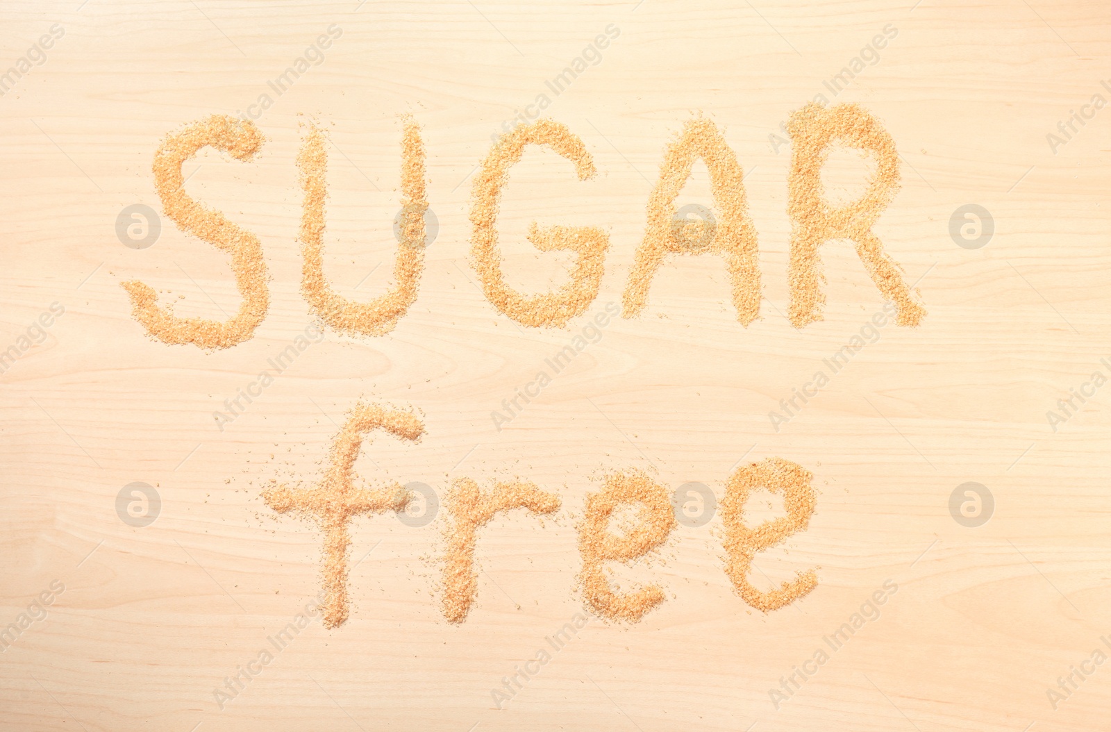 Photo of Phrase SUGAR FREE on wooden background