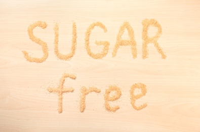 Phrase SUGAR FREE on wooden background