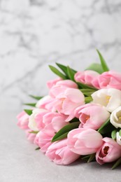 Beautiful bouquet of tulips on light table