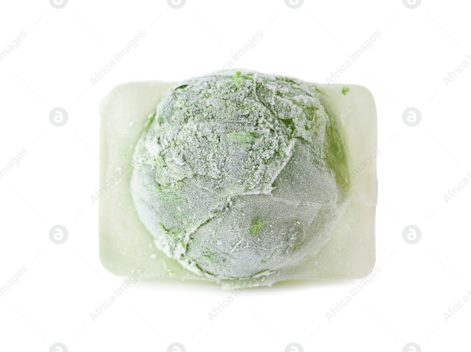 Photo of Brussels sprouts in ice cube on white background. Frozen vegetables