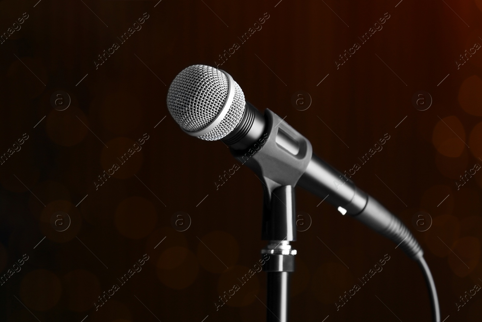 Photo of Microphone on dark background, space for text