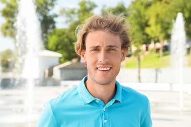 Photo of Portrait of handsome young man on street