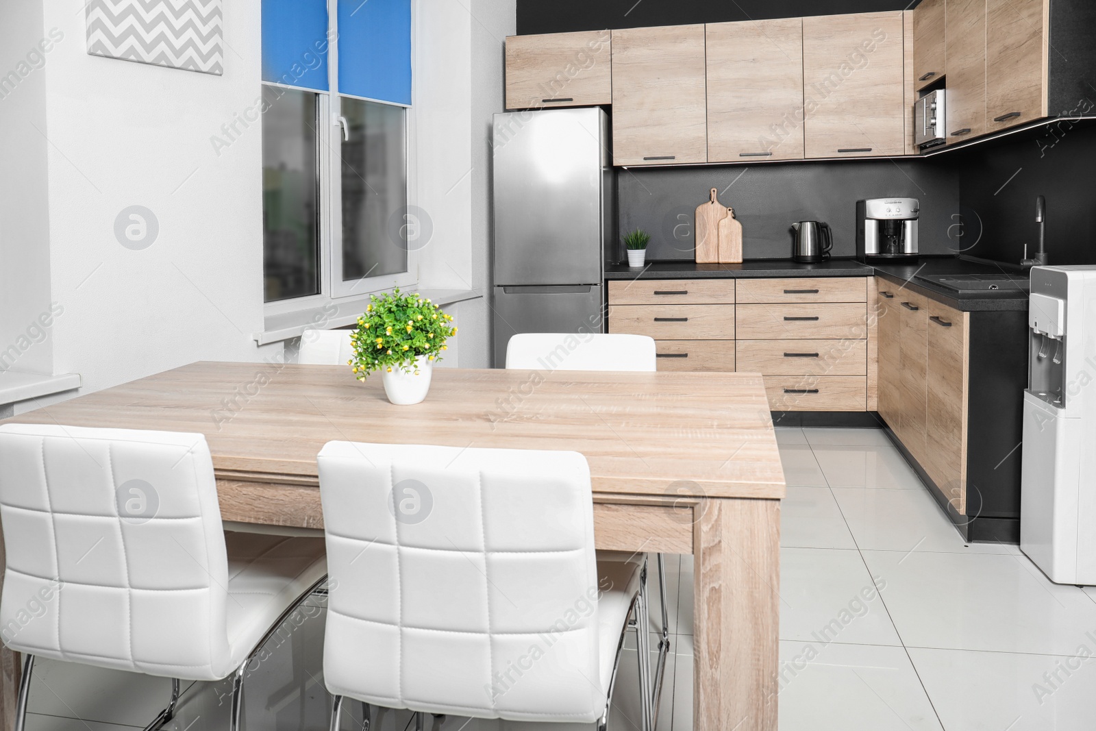 Photo of Cozy modern kitchen interior with new furniture and appliances