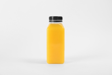 Bottle with delicious fresh juice on white background