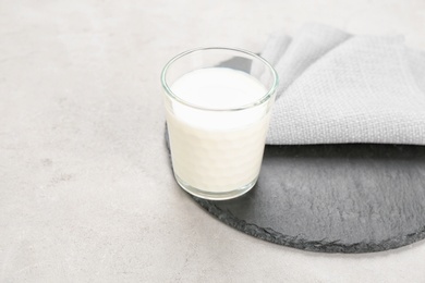 Photo of Glass of milk on table. Fresh dairy product