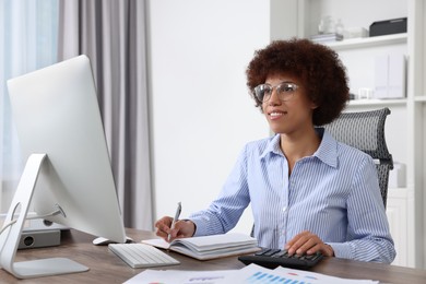 Professional accountant working on computer in office