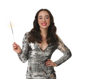 Photo of Christmas celebration. Beautiful young woman in stylish dress with sparkler isolated on white