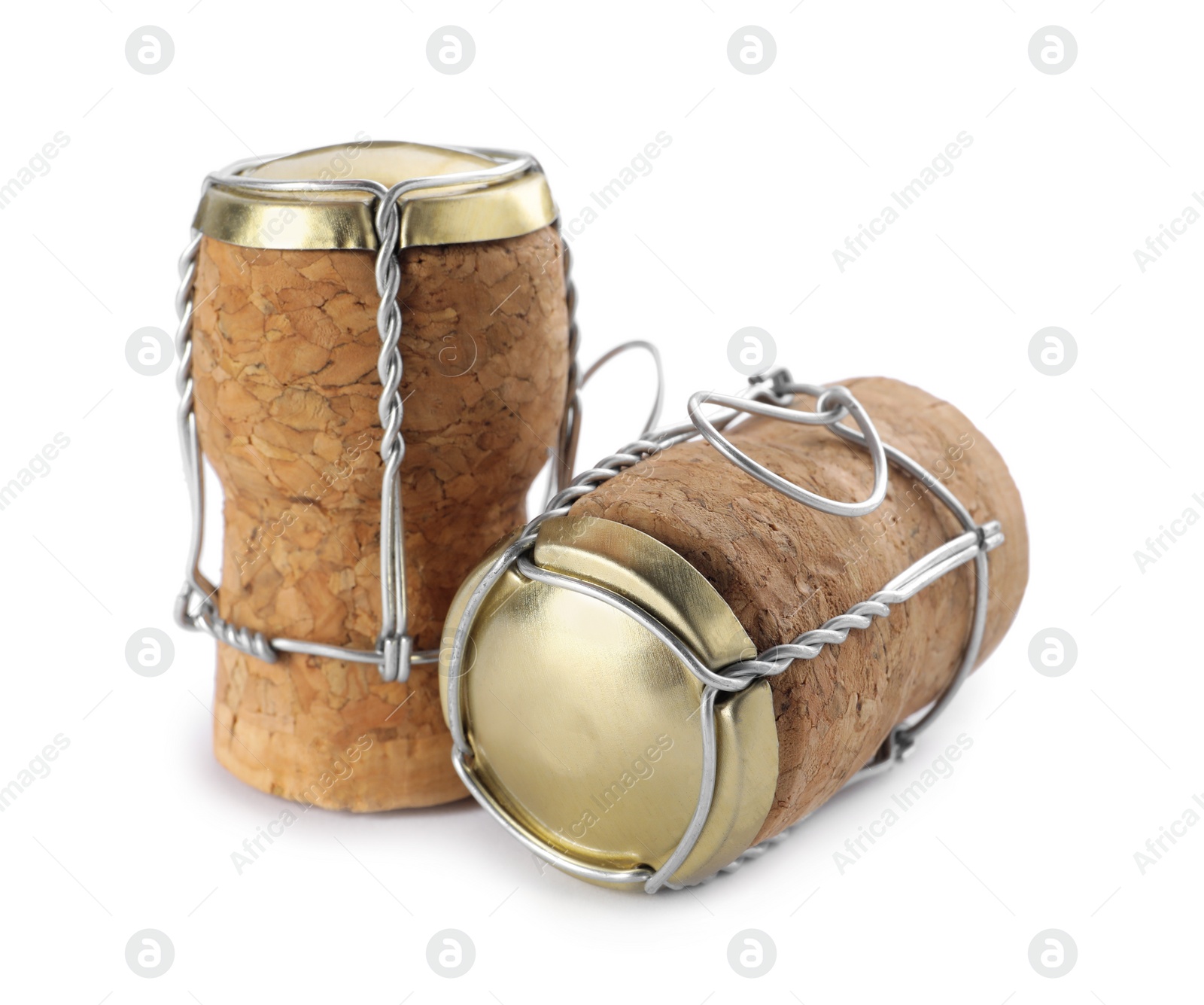 Photo of Corks of sparkling wine and muselet caps on white background