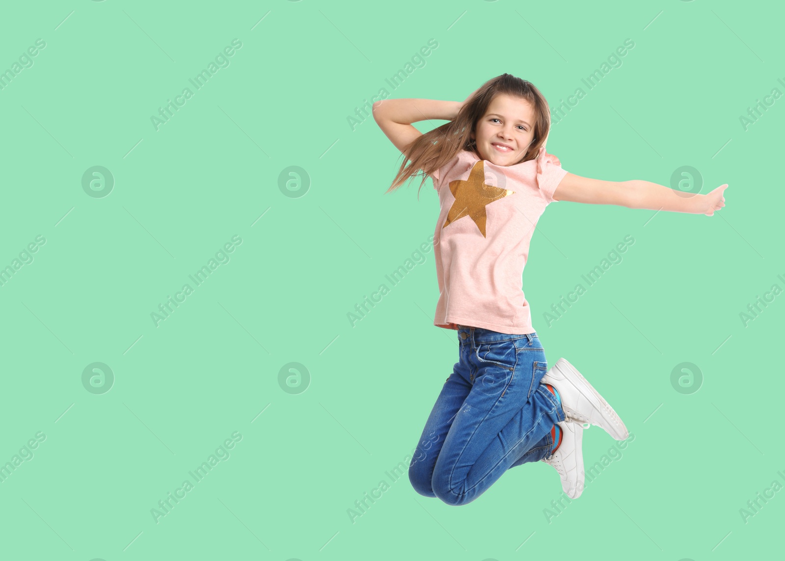 Image of Cute girl jumping on aquamarine background, space for text