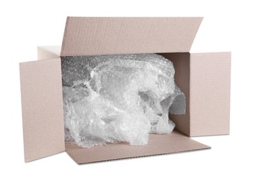 Photo of Transparent bubble wrap in cardboard box isolated on white