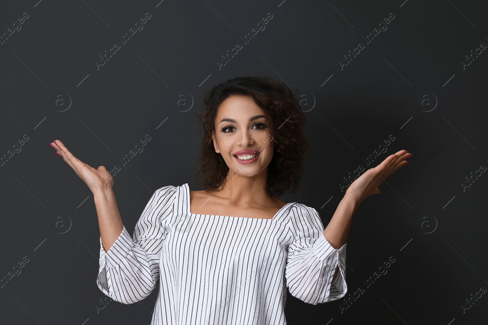 Photo of Emotional woman in casual outfit on black background