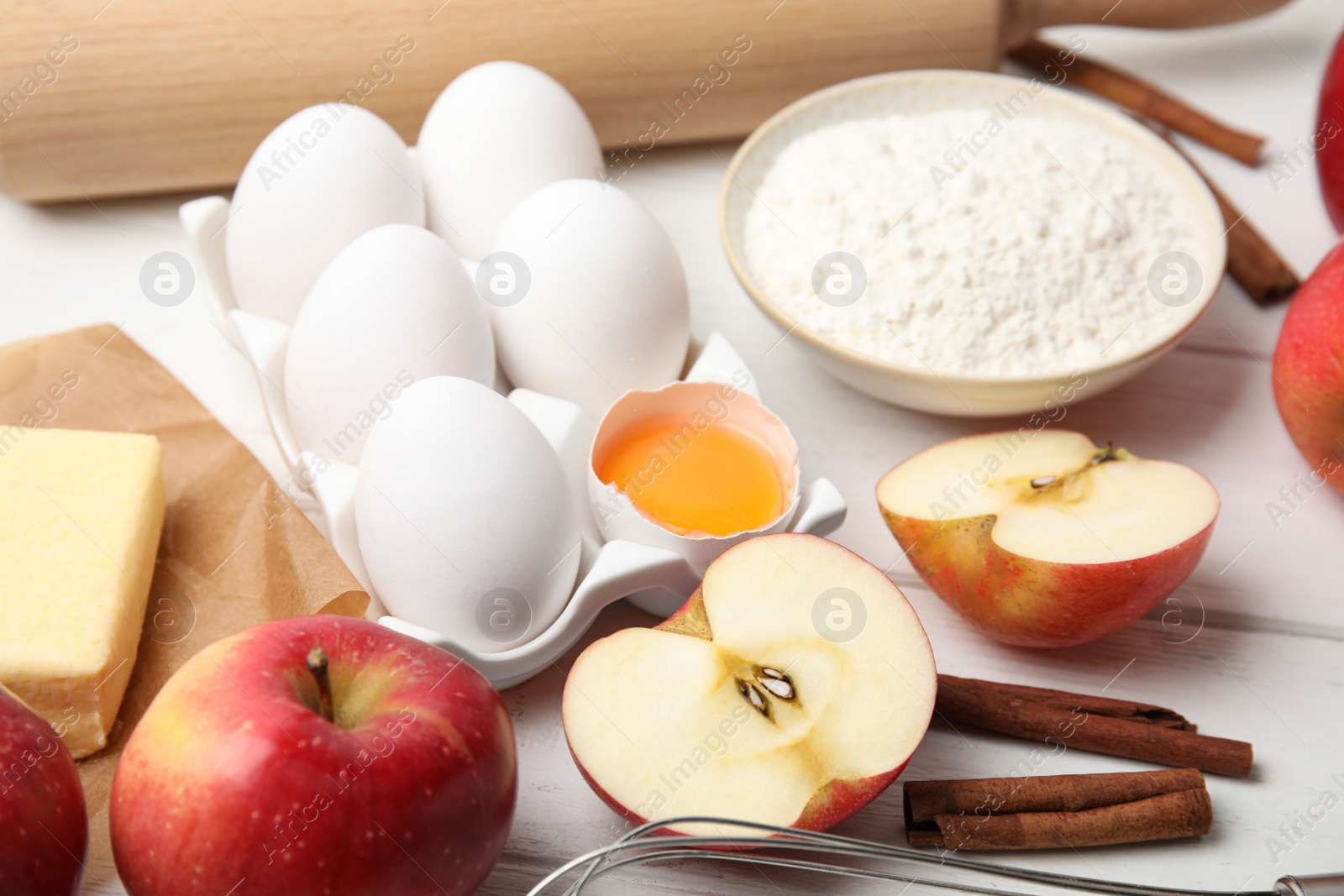 Photo of Traditional English apple pie ingredients on wooden table