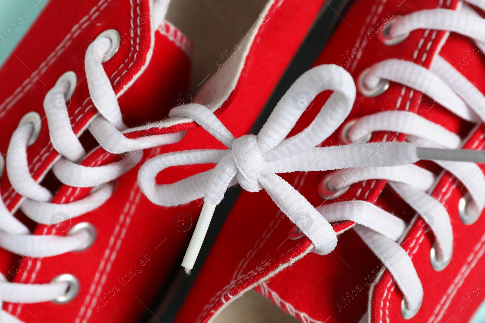 Photo of Pair of stylish shoes with white laces, closeup