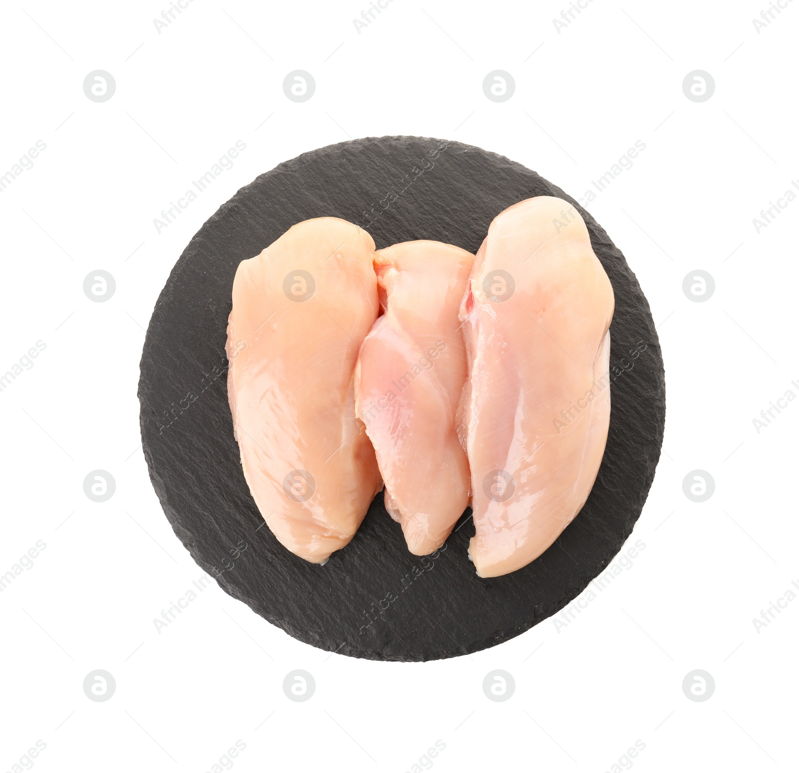 Photo of Slate plate with raw chicken breasts on white background, top view. Fresh meat