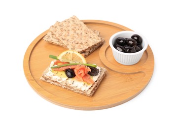 Photo of Fresh crunchy crispbreads with cream cheese, salmon, olives, lemon and green onion on white background