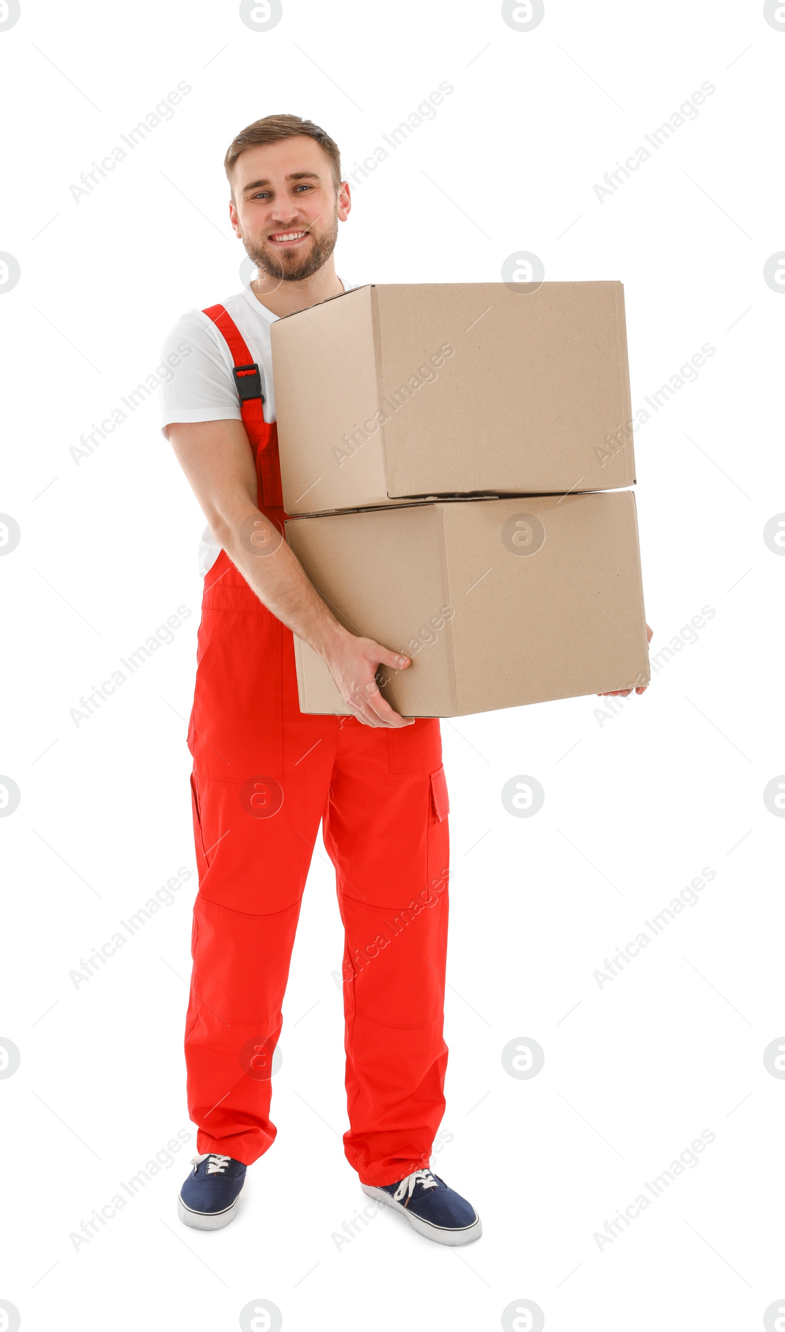 Photo of Young worker carrying boxes isolated on white. Moving service