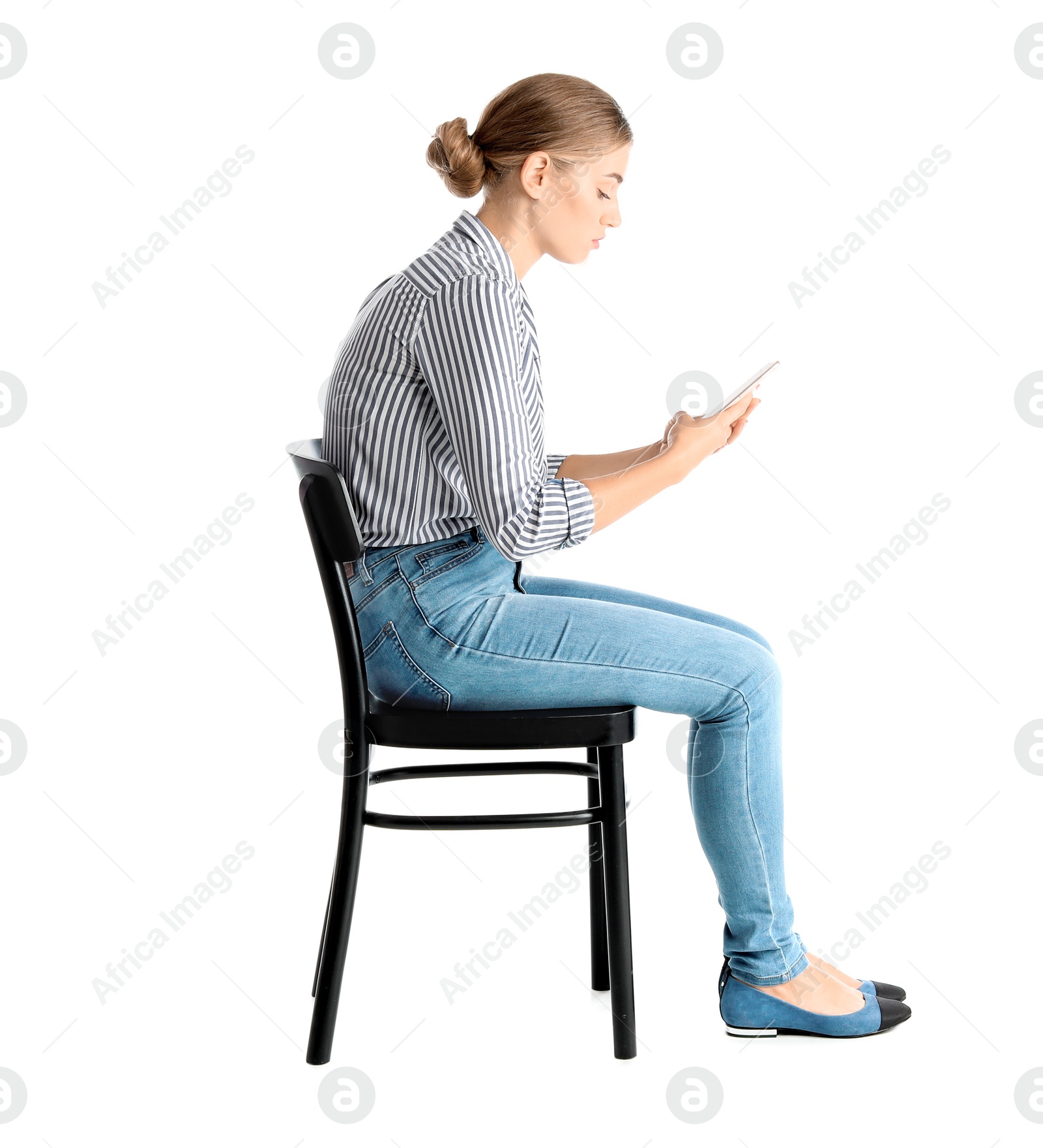 Photo of Woman with mobile phone sitting on chair against white background. Posture concept