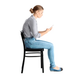 Photo of Woman with mobile phone sitting on chair against white background. Posture concept