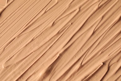 Texture of liquid skin foundation as background, closeup