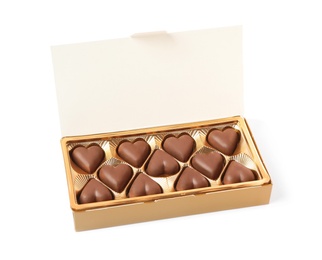 Photo of Delicious heart shaped chocolate candies in box isolated on white