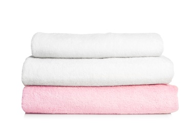 Photo of Folded soft terry towels on white background