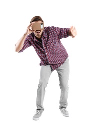 Photo of Young man using cardboard virtual reality headset, isolated on white