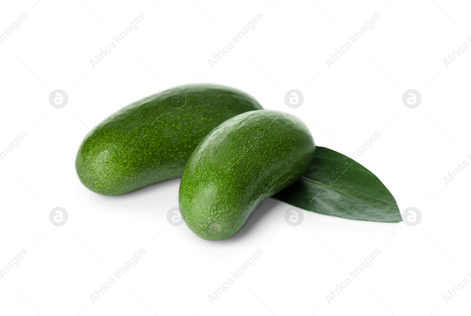 Photo of Fresh whole seedless avocados with leaf isolated on white