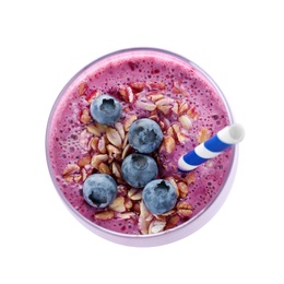 Glass of tasty blueberry smoothie with muesli on white background, top view