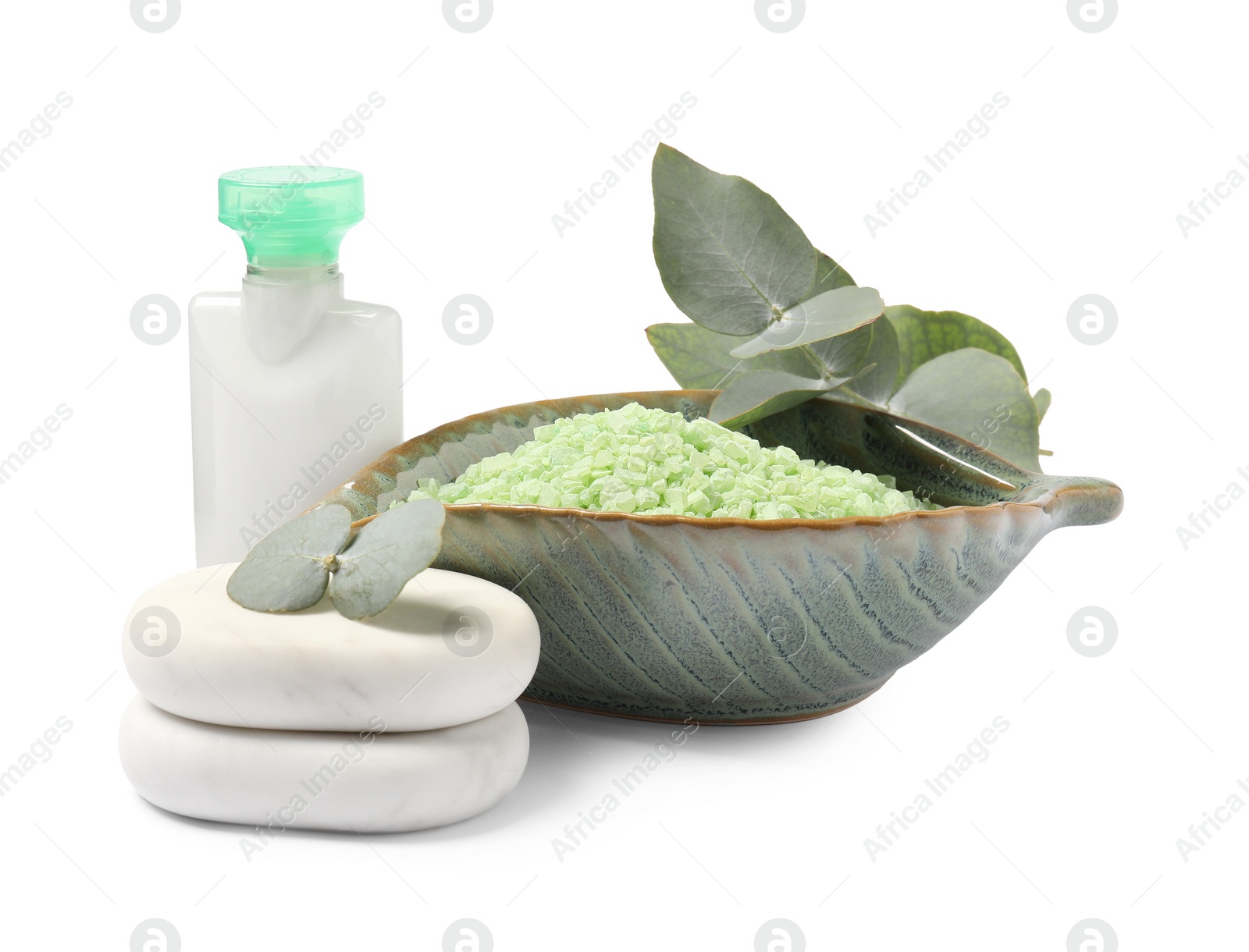 Photo of Green sea salt in bowl, cosmetic product, spa stones and eucalyptus leaves isolated on white