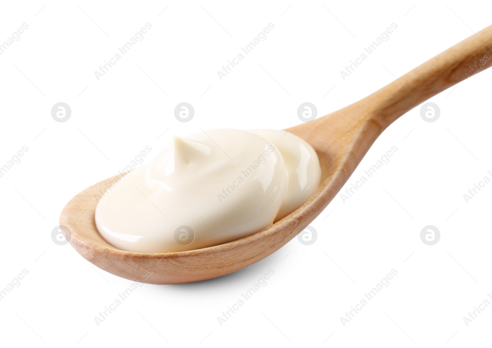 Photo of Natural yogurt in wooden spoon isolated on white