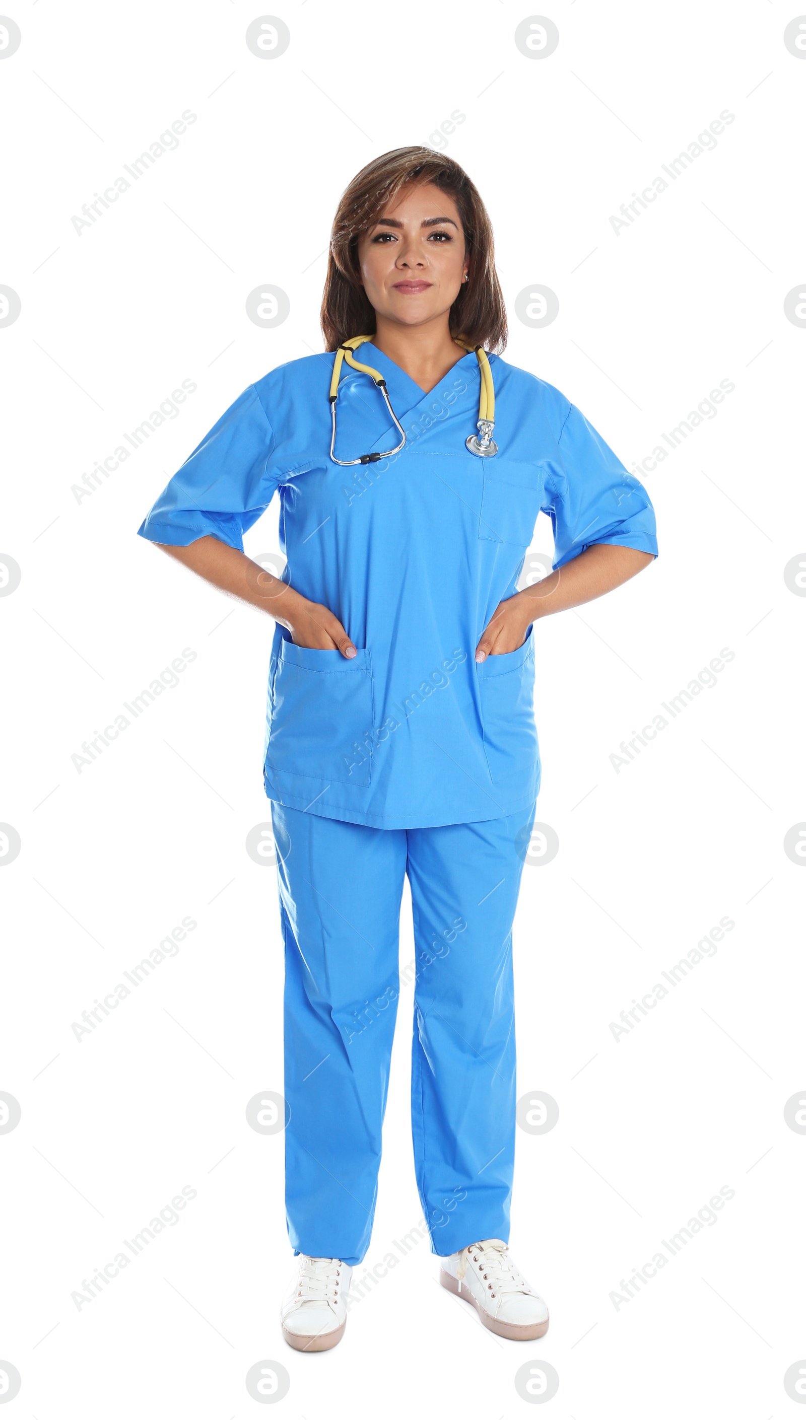 Photo of Full length portrait of female Hispanic doctor isolated on white. Medical staff