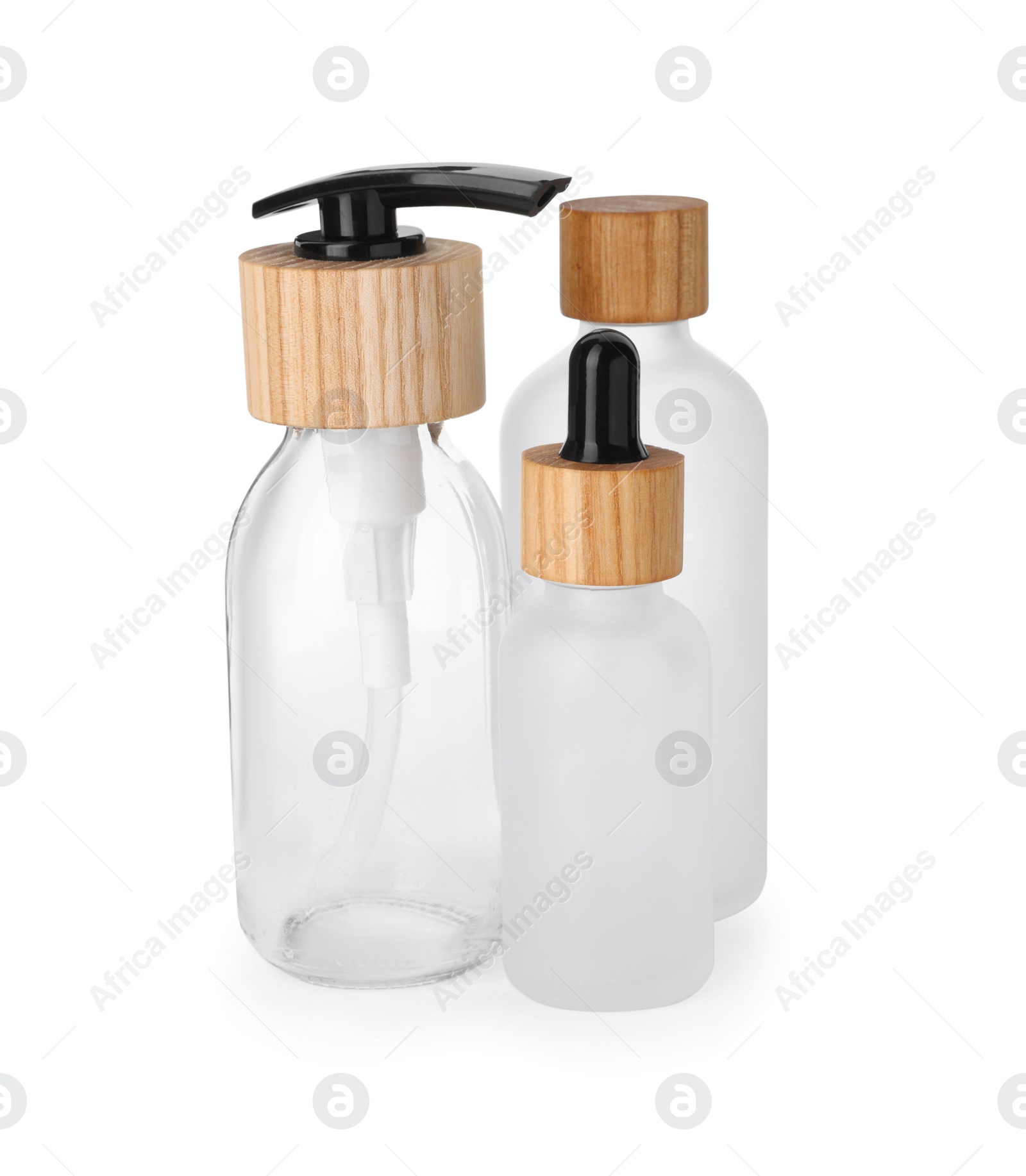 Photo of Different glass bottles with dropper and dispenser cap isolated on white