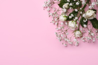 Photo of Beautiful white gypsophila and roses on pink background, top view. Space for text