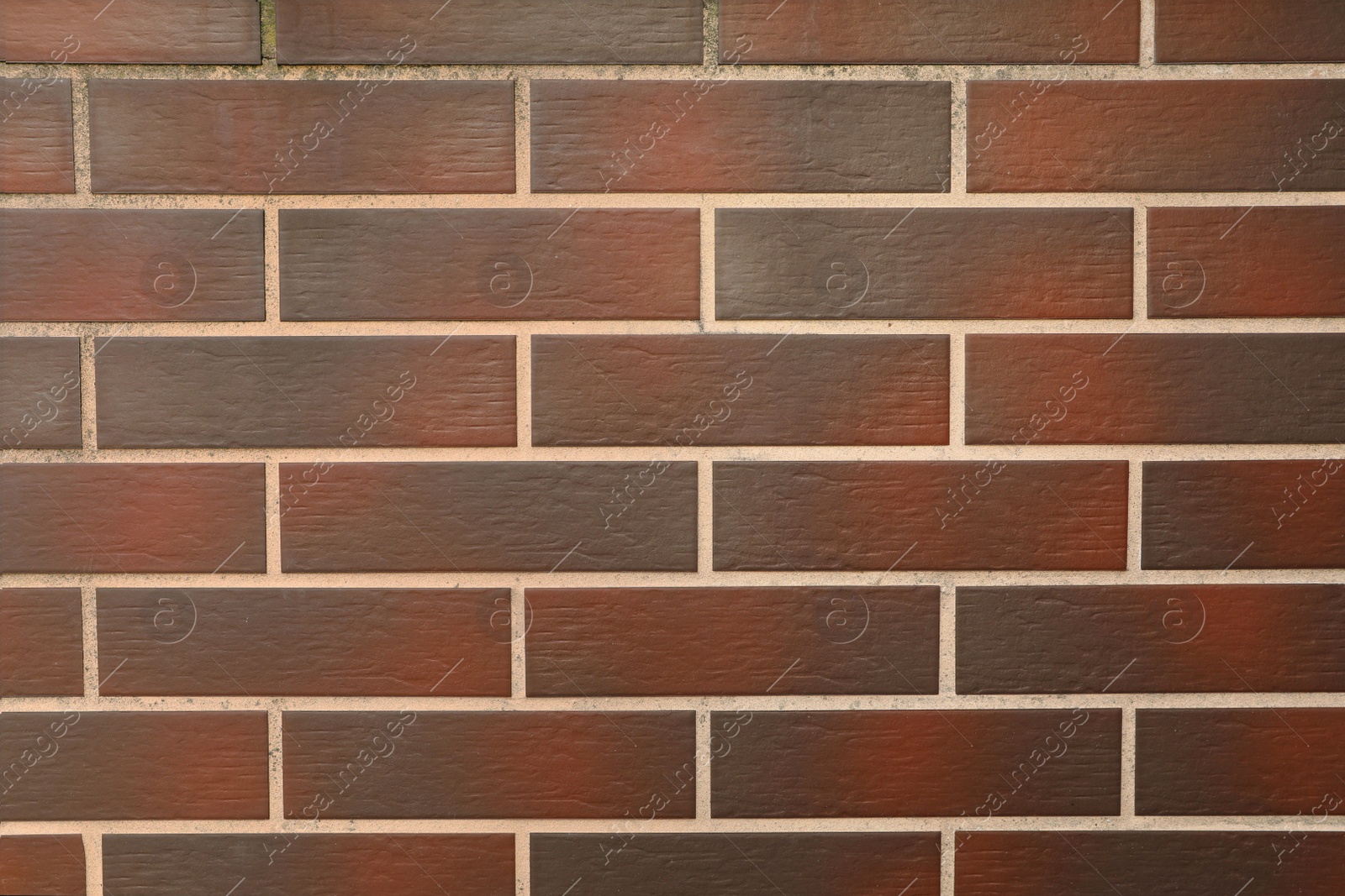 Photo of Texture of brown brick wall as background