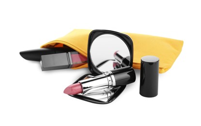 Photo of Stylish pocket mirror and cosmetic bag with makeup products on white background