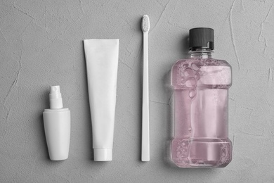 Flat lay composition with oral care  products on light background. Teeth hygiene