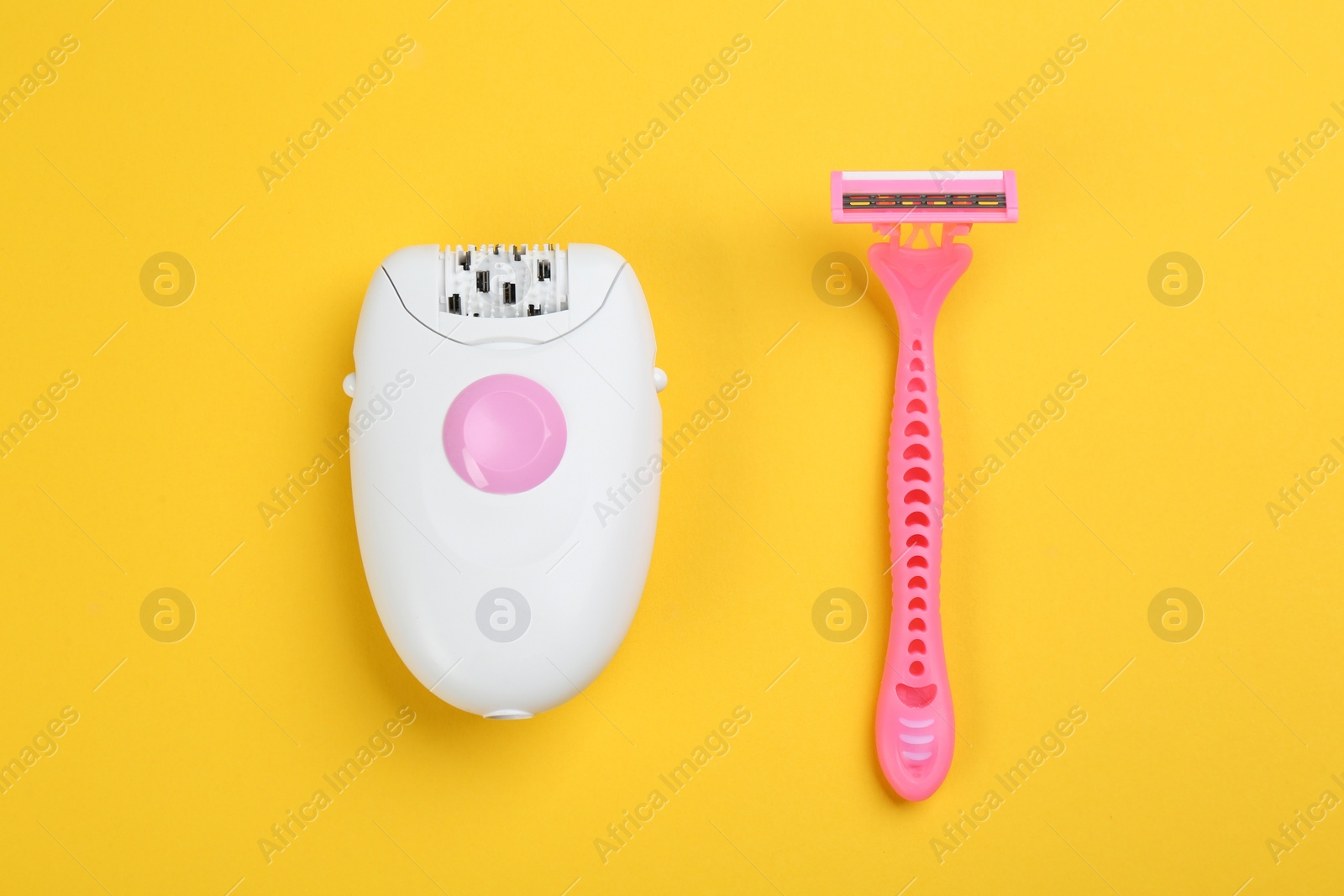 Image of Modern epilator and shaving razor on yellow background, flat lay