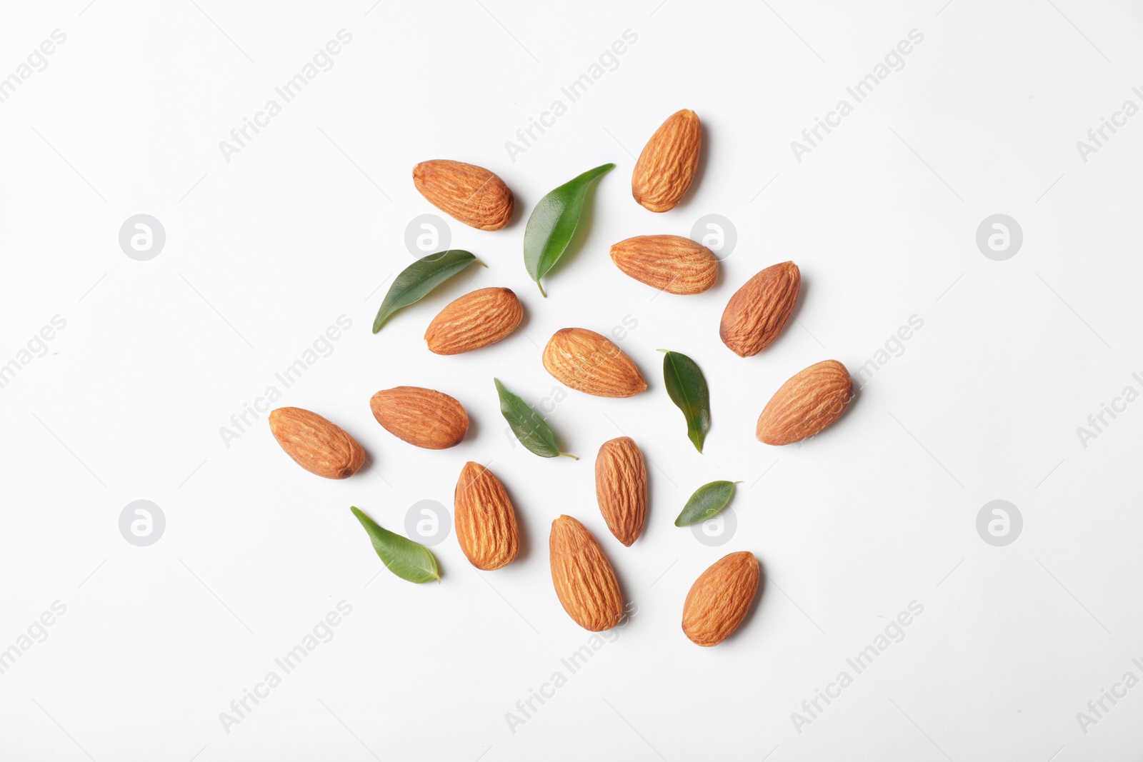 Photo of Composition with organic almond nuts on white background, top view