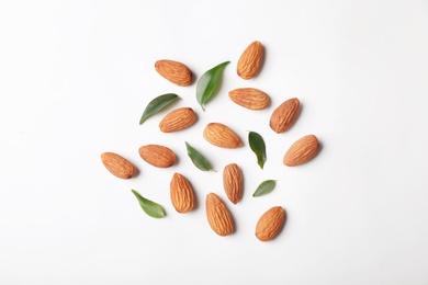 Photo of Composition with organic almond nuts on white background, top view