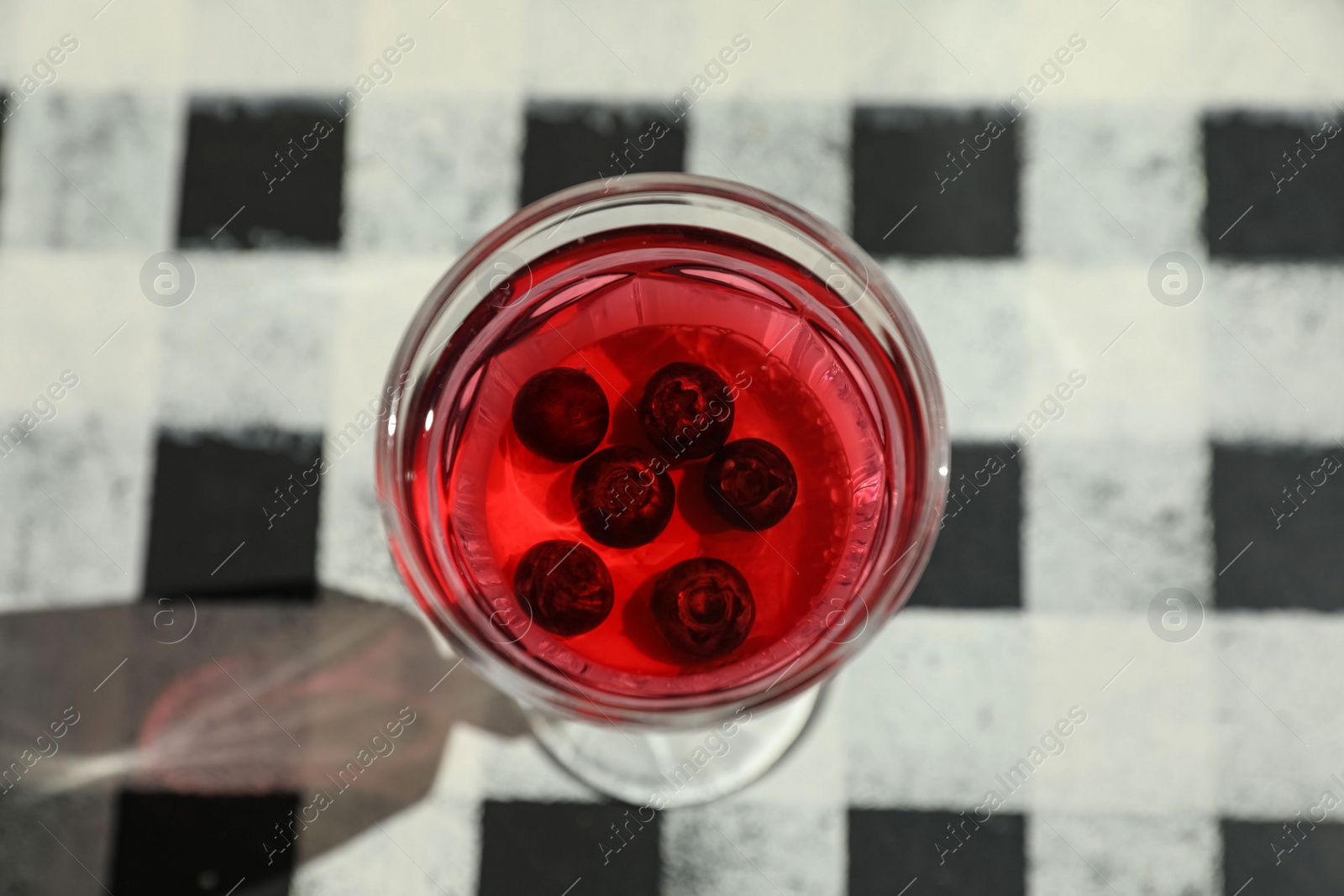 Photo of Delicious panna cotta dessert with berries on table, closeup. View from above