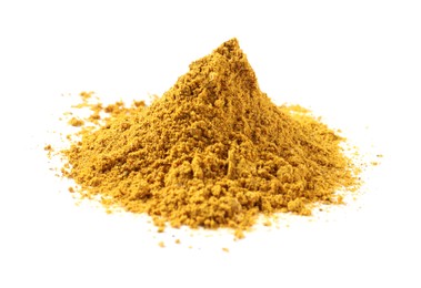 Photo of Pile of dry curry powder isolated on white