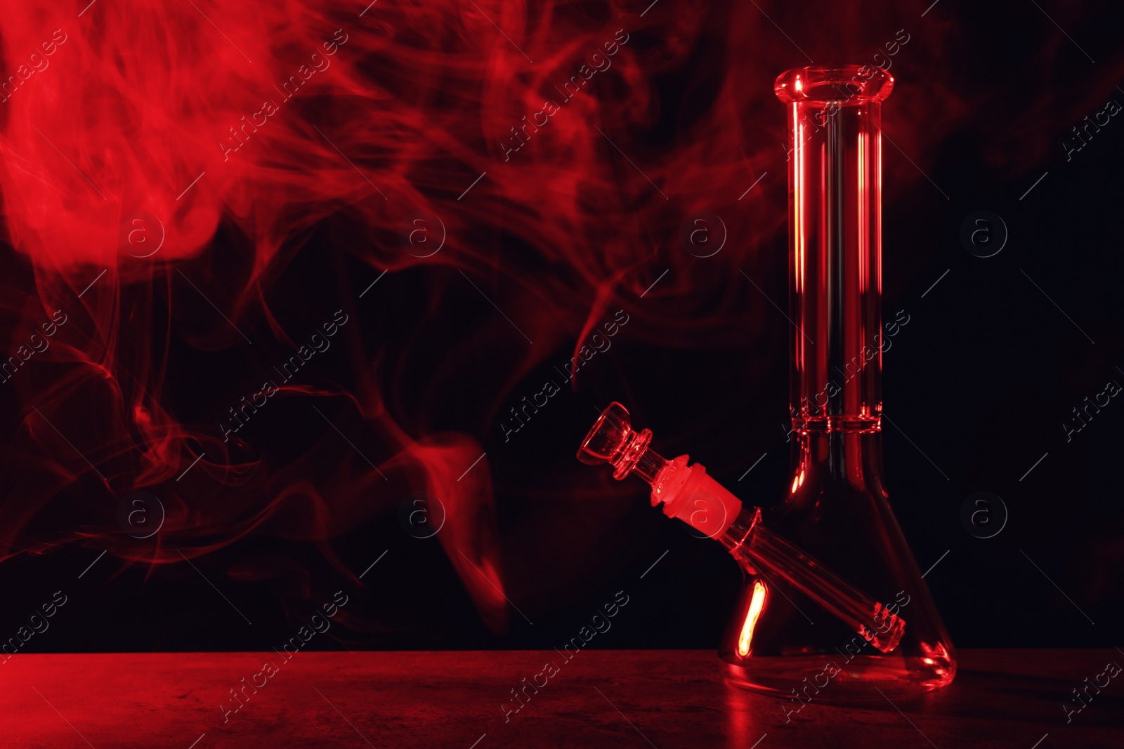 Photo of Glass bong and smoke on black background, space for text. Smoking device