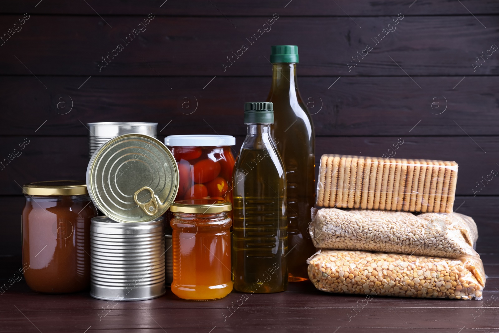 Photo of Different products on wooden table. Food donation