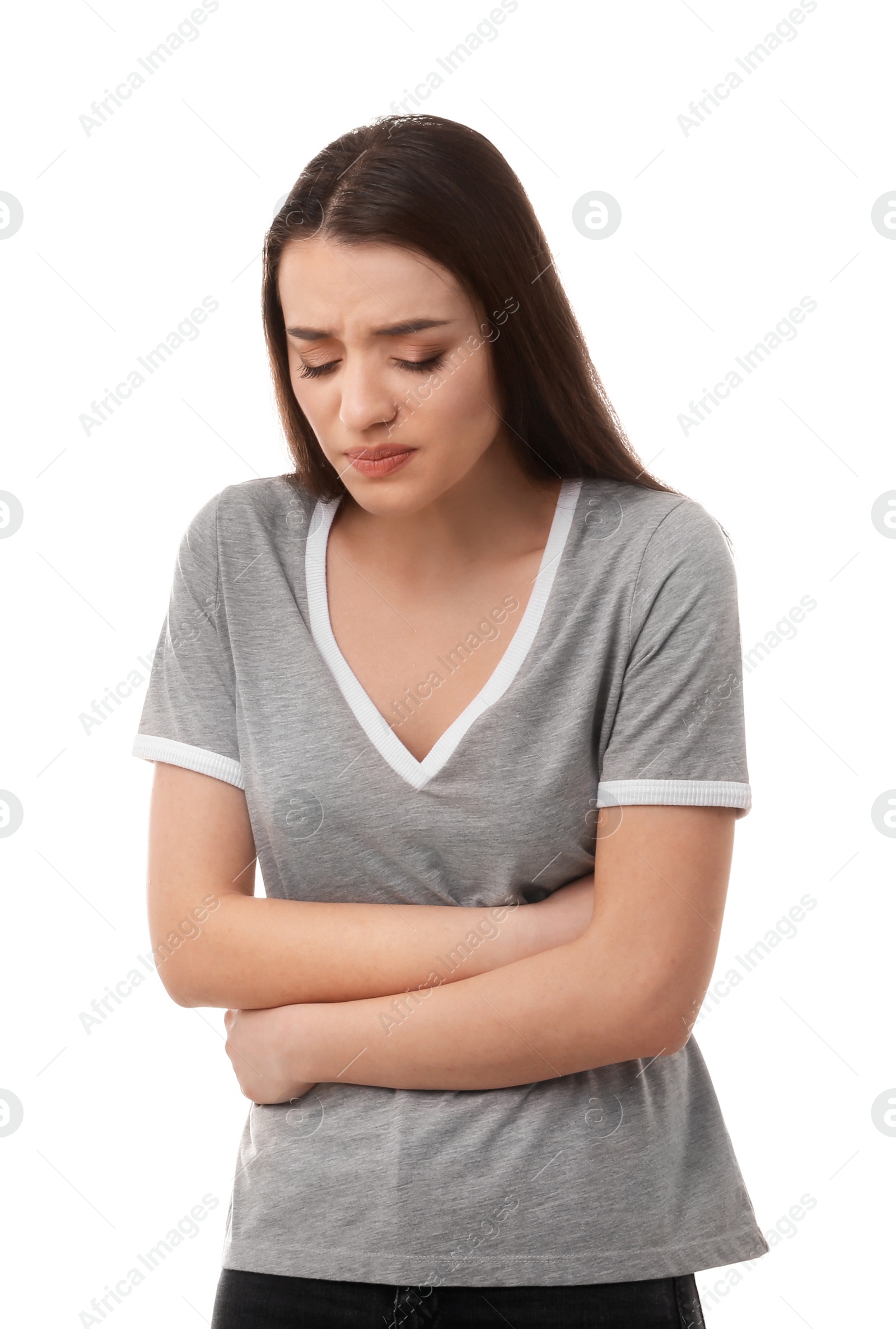 Photo of Young woman suffering from abdominal pain on white background