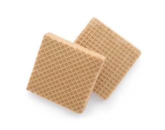 Photo of Delicious crispy wafers on white background, top view. Sweet food