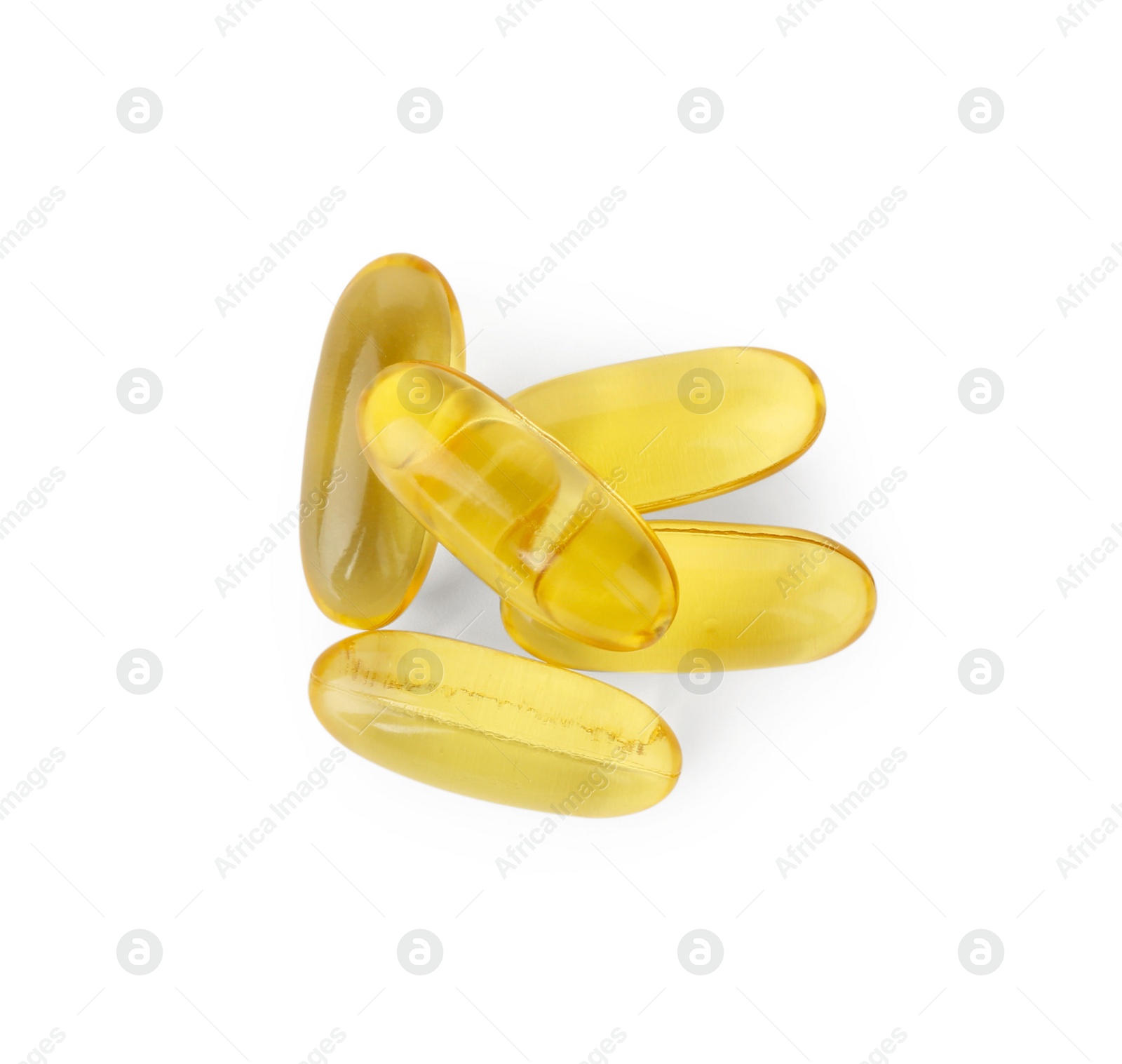 Photo of Many yellow vitamin capsules isolated on white, top view