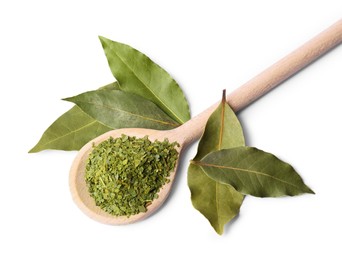 Whole and ground aromatic bay leaves on white background, top view