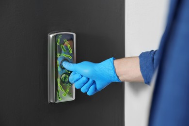 Image of Man in glove press button in elevator with germs, closeup